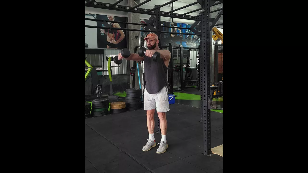 Standing Dumbbell Front Raise: Muscles Worked, Form, and How to Do It ...